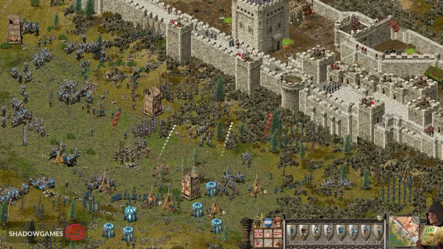 لشکر مهاجم با برج های محاصره پای قلعه سنگی در بازی آنلاین Stronghold: Definitive Edition